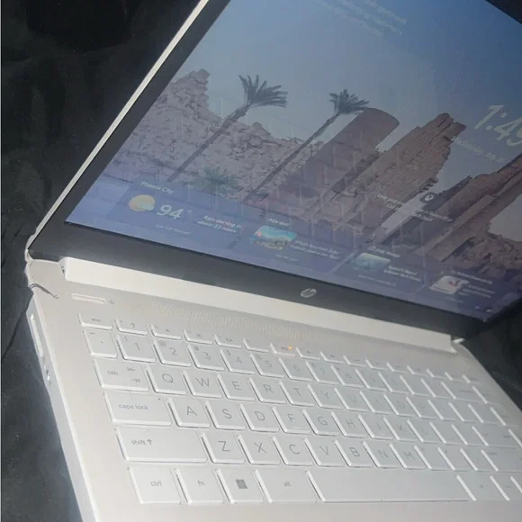 HP Silver Laptop with Black and Red Accessories